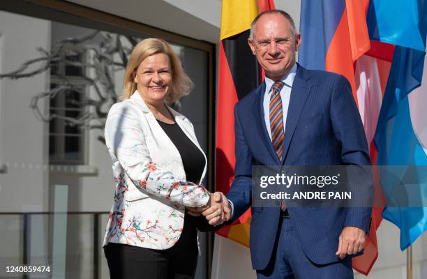 German Interior Minister Nancy Faeser shakes hands with her Austrian Counterpart Gerhard Karner at the Jewish Museum where she meets with her...