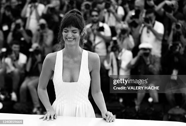 South African model and actress Charlbi Dean laughs during a photocall for the film "Triangle of Sadness" at the 75th edition of the Cannes Film...