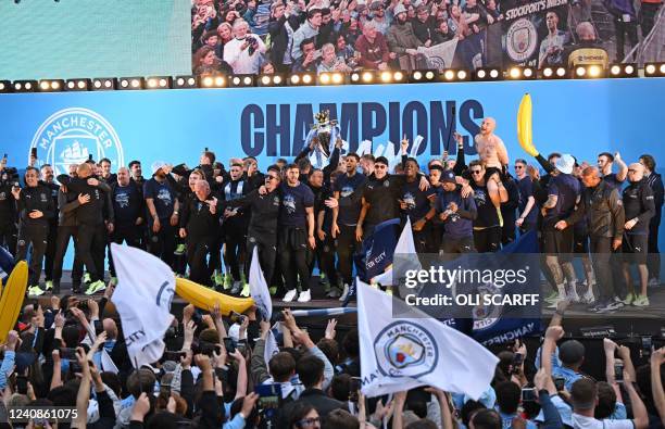 Manchester City's players attend an event for fans with members of the Manchester City football team following an open-top bus parade through...