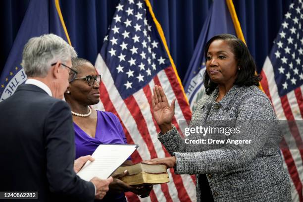 Chair of the Federal Reserve Jerome Powell administers the oath of office to Lisa Cook to serve as a member of the Board of Governors at the Federal...