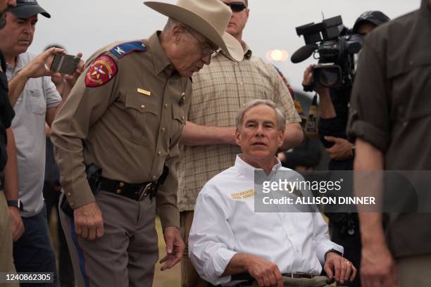Texas Governor Greg Abbott tours the US-Mexico border at the Rio Grande River in Eagle Pass, Texas, on May 23, 2022. - A Louisiana federal judge...