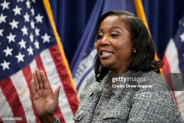 Lisa Cook takes the oath of office to serve as a member of the Board of Governors at the Federal Reserve System during a ceremony at the William...