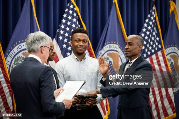 Chair of the Federal Reserve Jerome Powell administers the oath of office to Philip Jefferson to serve as a member of the Board of Governors at the...