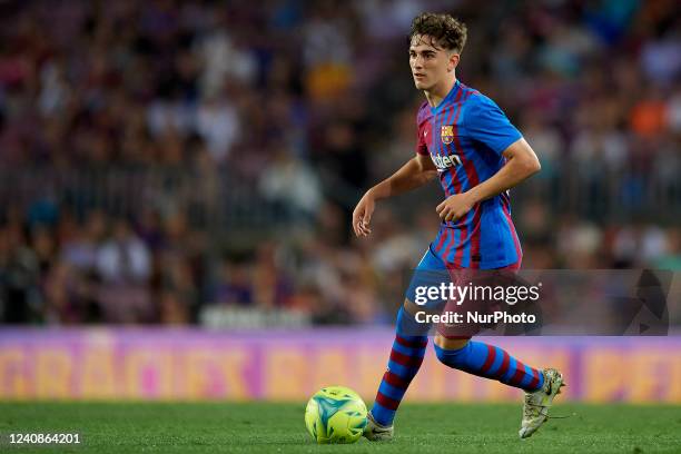 Gavi of Barcelona runs with the ball during the LaLiga Santander match between FC Barcelona and Villarreal CF at Camp Nou on May 22, 2022 in...