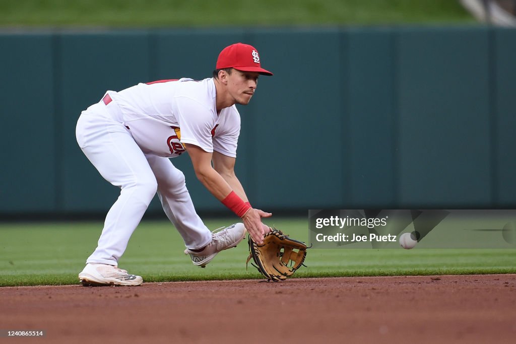 Tommy Edman of the St. Louis Cardinals fields a ground ball against ...