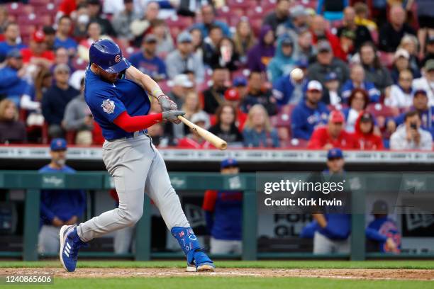 Patrick Wisdom of the Chicago Cubs hits a three-run home run in fourth inning of the game against the Cincinnati Reds at Great American Ball Park on...