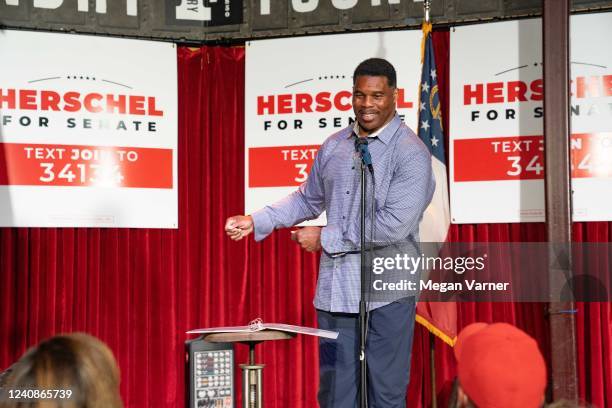Heisman Trophy winner and Republican candidate for US Senate Herschel Walker speaks at a rally on May 23, 2022 in Athens, Georgia. Tomorrow is the...