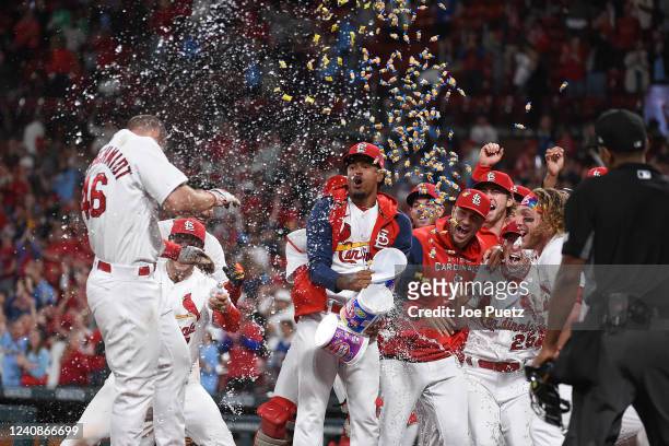 Paul Goldschmidt of the St. Louis Cardinals is congratulated by teammates after hitting a walk-off grand slam against the Toronto Blue Jays during...