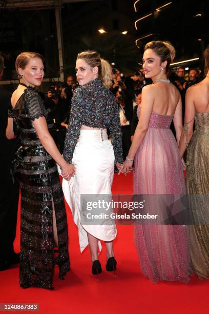 Léa Seydoux, Kristen Stewart and Denise Capezza depart the screening of "Crimes Of The Future" during the 75th annual Cannes film festival at Palais...