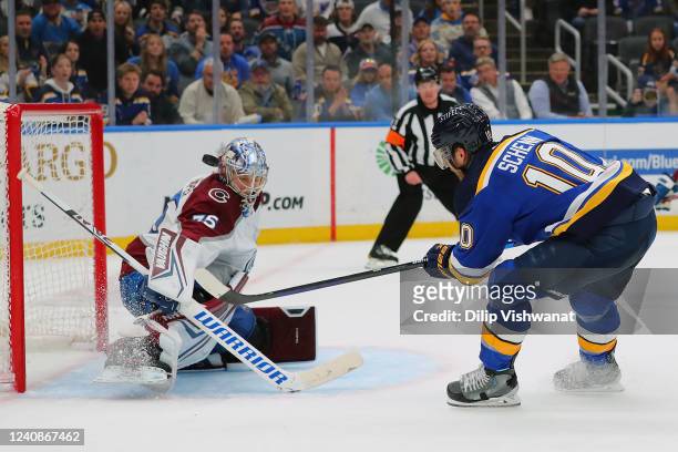 Darcy Kuemper of the Colorado Avalanche makes a save against Brayden Schenn of the St. Louis Blues in the third period during Game Four of the Second...