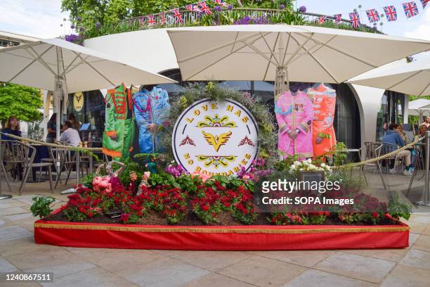 Flowers display a tribute to The Beatles 'Sgt. Pepper's Lonely Hearts Club Band' is seen in Duke Of York Square during the free floral art show at...