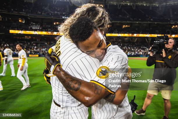 Jose Azocar and Jorge Alfaro of the San Diego Padres celebrate after a walk-off victory against the Milwaukee Brewers at Petco Park on May 23, 2022...