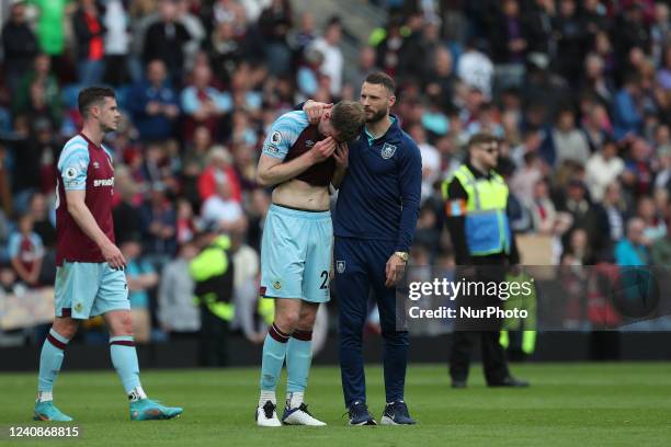 Nathan Collins of Burnley in tears after their defeat and relegation during the Premier League match between Burnley and Newcastle United at Turf...