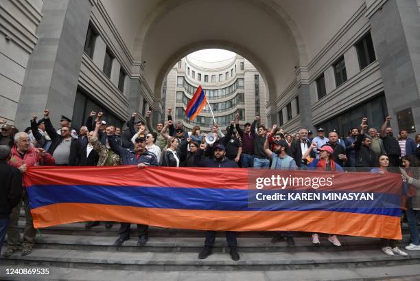 Opposition supporters block the Armenian Foreign Ministry building during anti-government demonstrations in the capital Yerevan on May 24, 2022. -...