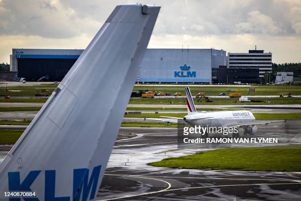 An Air France plane is pictured on the tarmac of the Schiphol airport on May 24, 2022 as Air France-KLM announced a bid to raise 2,26 billion euros...