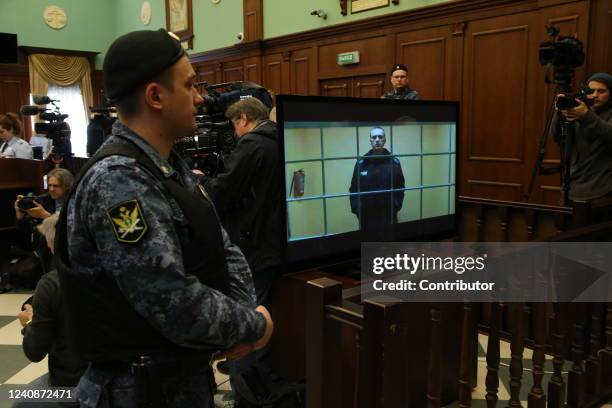 Russian opposition politician, anti-corruption campaigner and founder of the Anti-Corruption Foundation , Alexey Navalny is seen on the screen during...