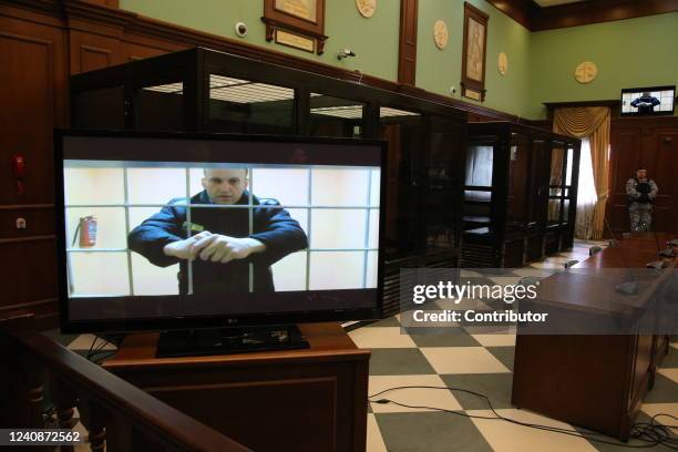 Russian opposition politician, anti-corruption campaigner and founder of the Anti-Corruption Foundation , Alexey Navalny is seen on the screen during...