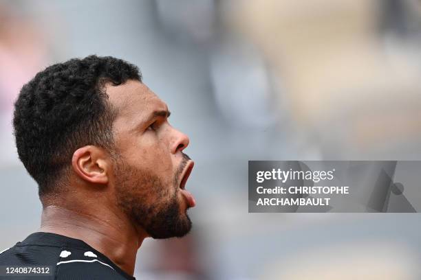 France's Jo-Wilfried Tsonga reacts as he plays against Norway's Casper Ruud during their men's singles match on day three of the Roland-Garros Open...