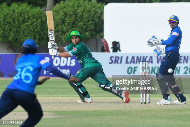 Pakistan's Nida Dar plays a shot during first women T20 cricket match between Pakistan and Sri Lanka at the Southend Cricket Club in Karachi on May...