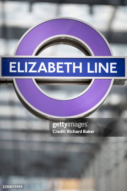 The Elizabeth Line's roundel at paddington station on the day that the capital's Elizabeth Line finally opens, on 24th May 2022, in London, England....