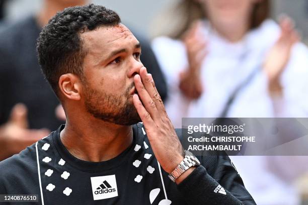 France's Jo-Wilfried Tsonga reacts after losing against Norway's Casper Ruud at the end of their men's singles match on day three of the...