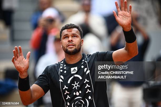 France's Jo-Wilfried Tsonga reacts after losing against Norway's Casper Ruud at the end of their men's singles match on day three of the...