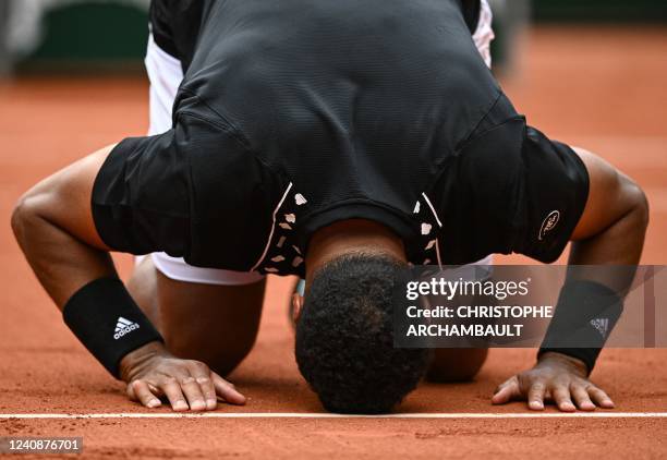 France's Jo-Wilfried Tsonga reacts after losing against Norway's Casper Ruud at the end of their men's singles match on day three of the...