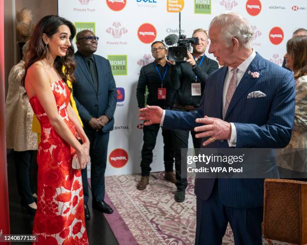 Prince Charles, Prince of Wales speaks with Amal Clooney at The Prince's Trust TK Maxx And Homesense Awards 2022 at Theatre Royal Drury Lane on May...