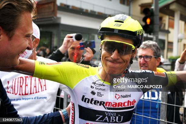Stage winner, Team Wanty's Czech rider Jan Hirt, reacts after crossing the finish line of the 16th stage of the Giro d'Italia 2022 cycling race, 177...