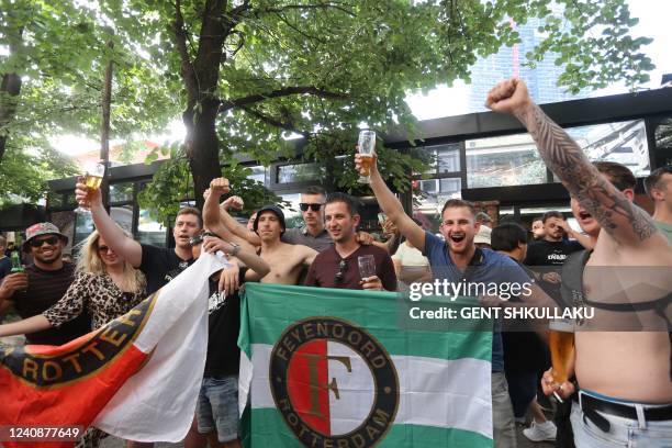 Feyenoord supporters cheer as they drink beer in Tirana on May 24 on the eve of the UEFA Europa Conference League final football match between AS...