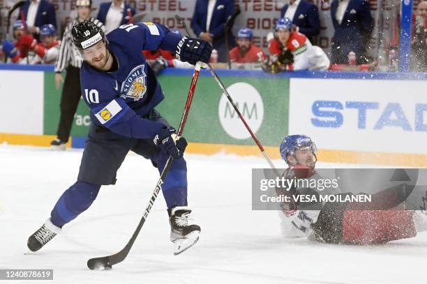 Czech Republic's defender Jan Scotka falls as Finland's forward Joel Armia shoots to score the game opening goal during the IIHF Ice Hockey World...