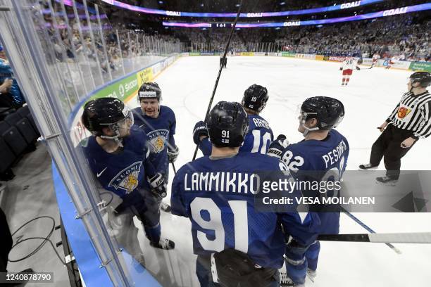 Finnish players celebrate scoring the opening goal during the IIHF Ice Hockey World Championships preliminary round Group B match between Finland and...