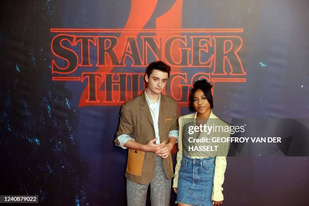 Actress Priah Ferguson and US actor Noah Schnapp pose upon their arrival for the Premiere of the US fiction horror TV series Stranger Things Season...