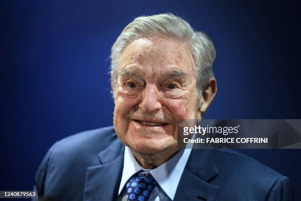 Hungarian-born US investor and philanthropist George Soros smiles after delivering a speech on the sidelines of the World Economic Forum annual...