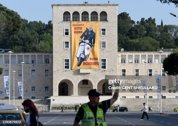 Giant poster of Roma's coach Jose Mourinho reading "Welcome to Little Roma" hangs on the facade of Tirana's University building on May 24 on the eve...