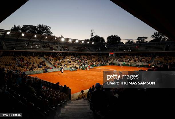 Spain's Pablo Carreno Busta returns the ball to France's Gilles Simon during their men's singles match on day three of the Roland-Garros Open tennis...