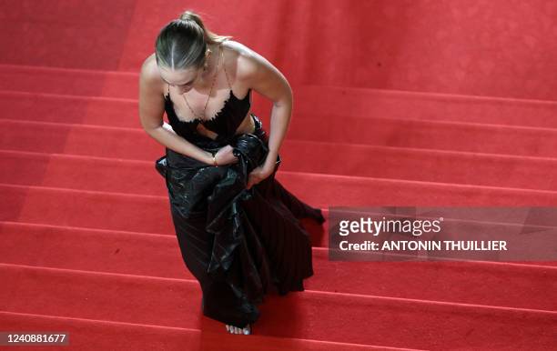 Guest arrives for the screening of the film "Nostalgia" during the 75th edition of the Cannes Film Festival in Cannes, southern France, on May 24,...