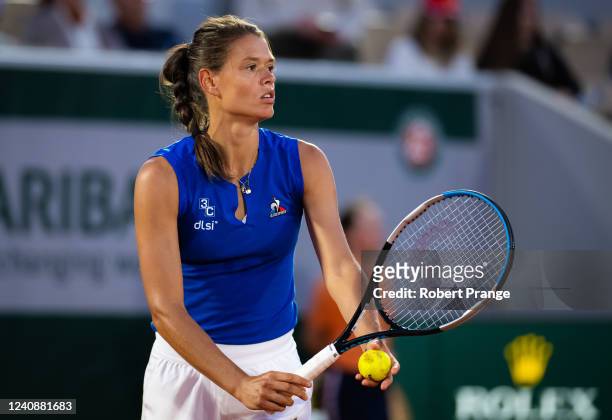 Chloe Paquet of France in action against Aryna Sabalenka of Belarus in her first round match on Day 3 at Roland Garros on May 24, 2022 in Paris,...