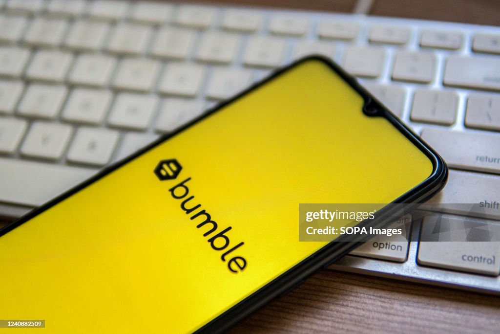 In this photo illustration, a Bumble logo seen displayed on...