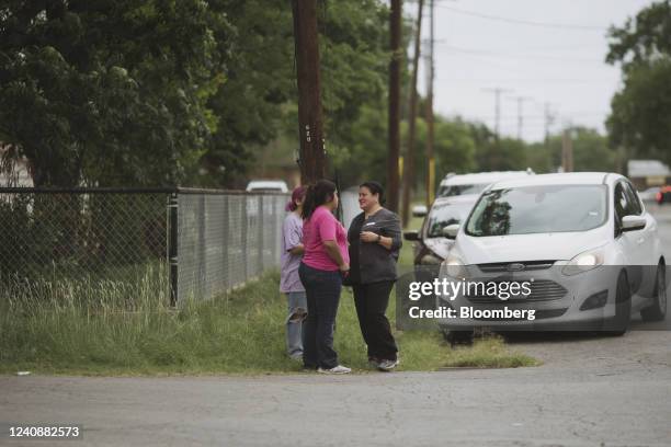 People react outside Robb Elementary School in Uvalde, Texas, US, on Tuesday, May 24, 2022. Fourteen students and one teacher were killed during a...