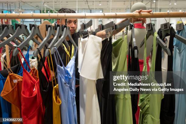 Glendale, CA Amazon Style employee Damian Lopez readies merchandise at the new Amazon Style clothing store at The Americana at Brand mall in Glendale...