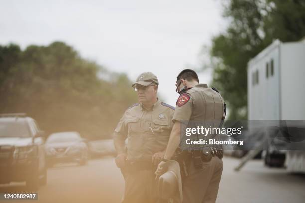 Texas state troopers outside Robb Elementary School in Uvalde, Texas, US, on Tuesday, May 24, 2022. Fourteen students and one teacher were killed...