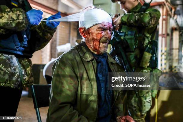 Man injured by Russian shelling receives first aid at the center of distribution of humanitarian aid in Severodonetsk. Severodonetsk, the largest...