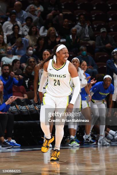 Arike Ogunbowale of the Dallas Wings smiles during the game against the Connecticut Sun on May 24, 2022 at Mohegan Sun Arena in Uncasville,...