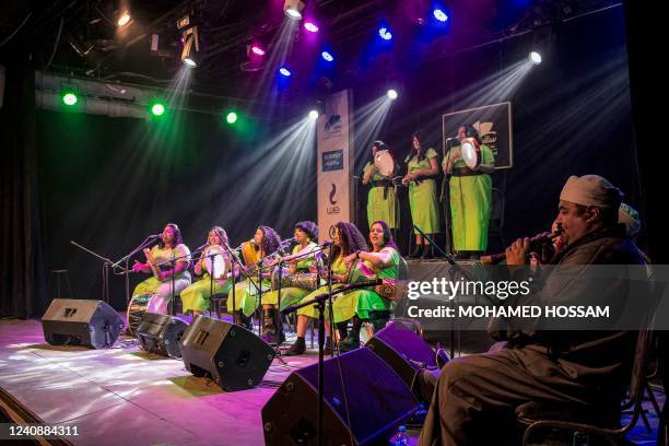 Women members of the "Tablet al-Sitt" perform with the the "daf" hand drums and the "tabla" drum while accompanied by male traditional woodwind...