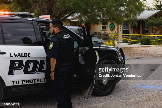 Uvalde Police gather outside the home of suspected gunman 18-year-old Salvador Ramos on May 24, 2022 in Uvalde, Texas. According to reports, Ramos...