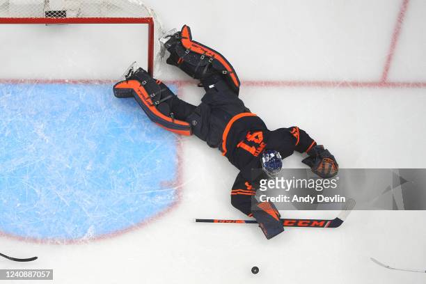Mike Smith of the Edmonton Oilers makes a save during Game Four of the Second Round of the 2022 Stanley Cup Playoffs against the Calgary Flames on...