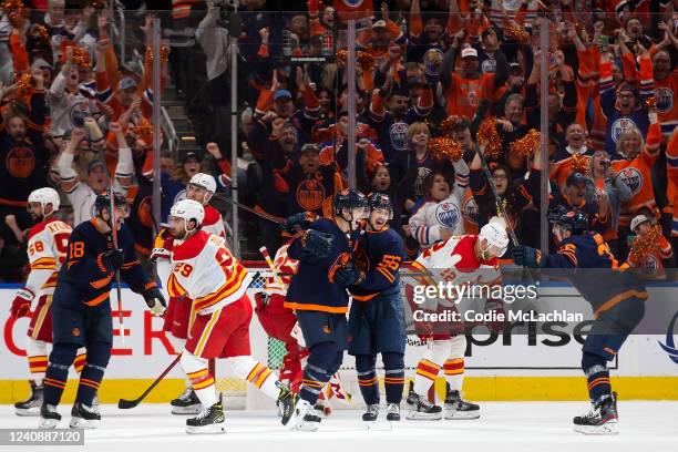 Ryan Nugent-Hopkins and Kailer Yamamoto of the Edmonton Oilers celebrate Nugent-Hopkins' goal against the Calgary Flames during the third period in...