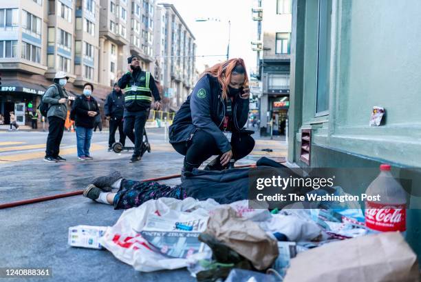 Early in the morning at the intersection of Jones and Turk Streets Urban Alchemys Danielle LeBlue calls the police when a homeless person still...