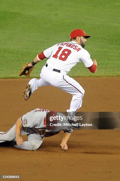 Danny Espinosa of the Washington Nationals forces out Sean Burroughs at second base during a baseball game at National Park on August 23, 2011 in...